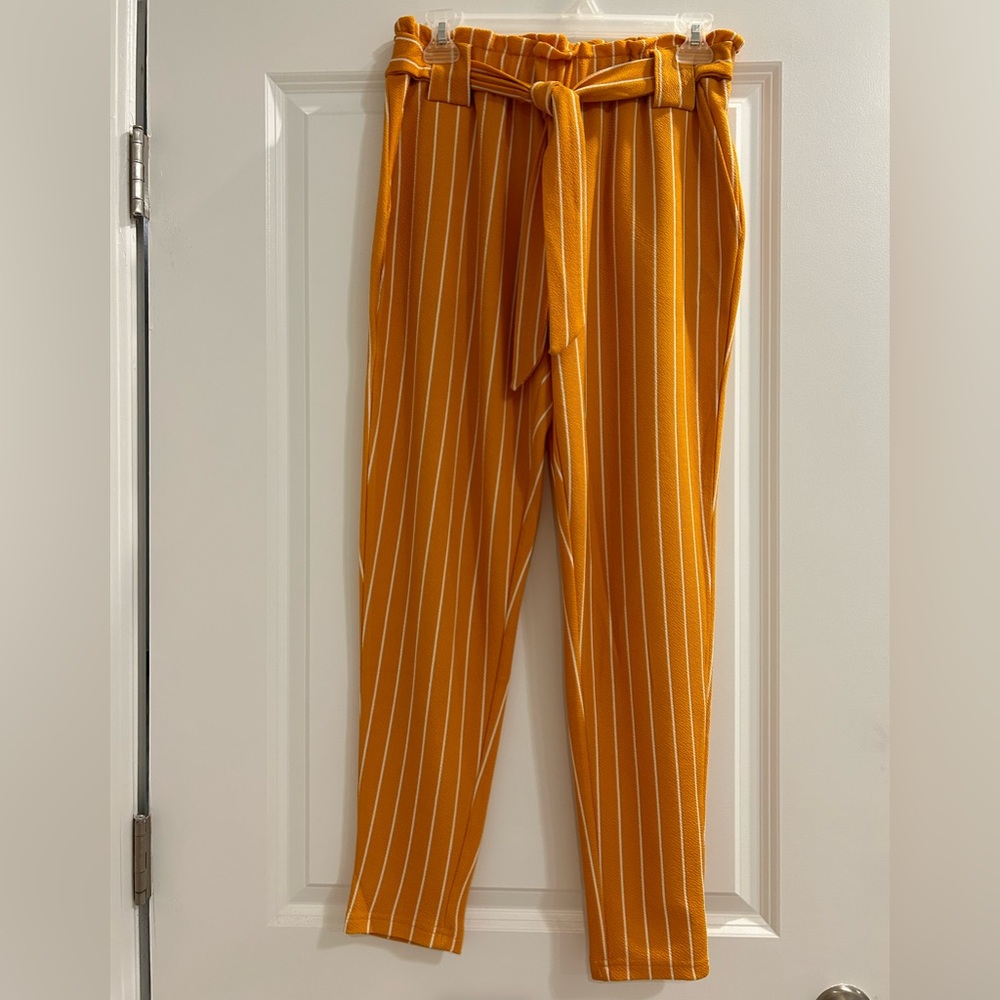 Mustard yellow pant with white stripes and pockets